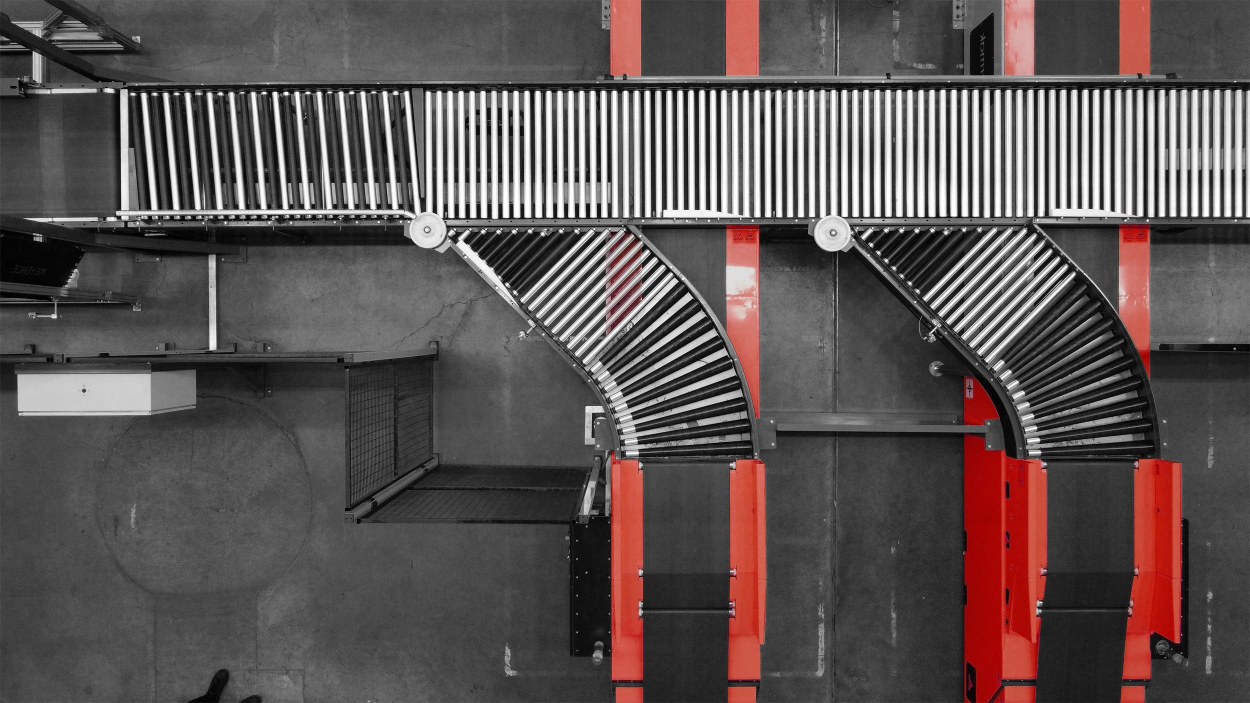 conveyor systems alongside other conveyors